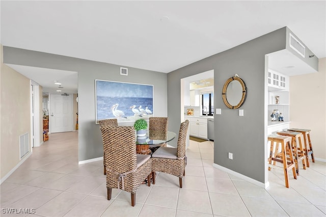 26235 Hickory Blvd Unit 9A, Bonita Springs, FL 34134 - dining space with light tile patterned floors and baseboards