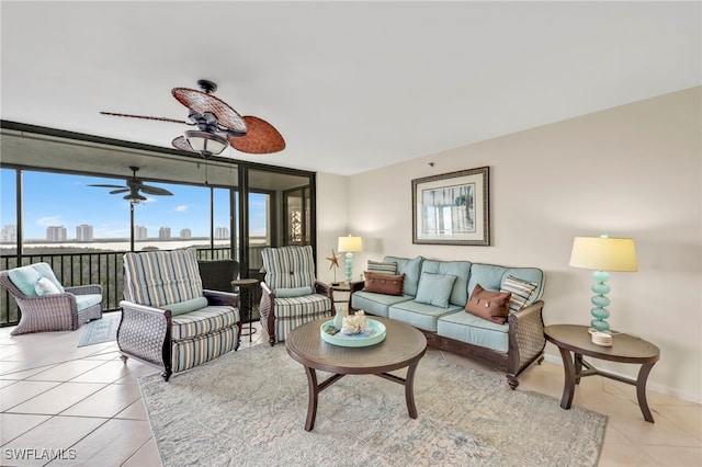 26235 Hickory Blvd Unit 9A, Bonita Springs, FL 34134 - living area with light tile patterned floors, floor to ceiling windows, and ceiling fan