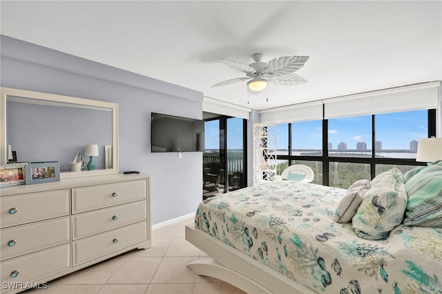 26235 Hickory Blvd Unit 9A, Bonita Springs, FL 34134 - bedroom with light tile patterned flooring, access to outside, and a ceiling fan