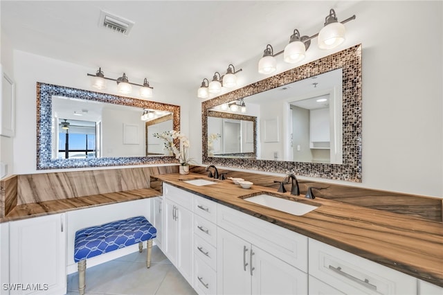 26235 Hickory Blvd Unit 9A, Bonita Springs, FL 34134 - full bathroom featuring double vanity and tile patterned floors