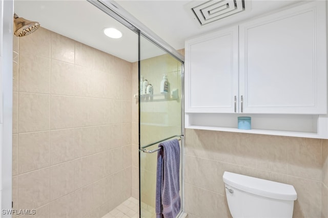 26235 Hickory Blvd Unit 9A, Bonita Springs, FL 34134 - bathroom featuring a shower stall and tile walls