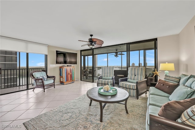 26235 Hickory Blvd Unit 9A, Bonita Springs, FL 34134 - tiled living room featuring a ceiling fan and a wall of windows