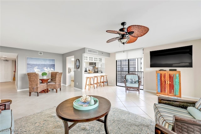 26235 Hickory Blvd Unit 9A, Bonita Springs, FL 34134 - living area with light tile patterned floors and ceiling fan