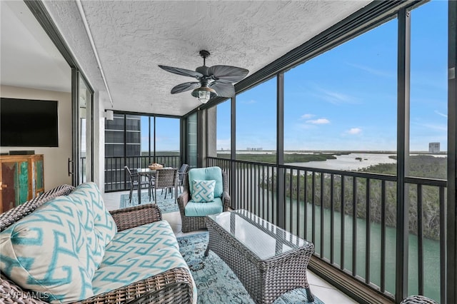 26235 Hickory Blvd Unit 9A, Bonita Springs, FL 34134 - sunroom featuring a water view and ceiling fan