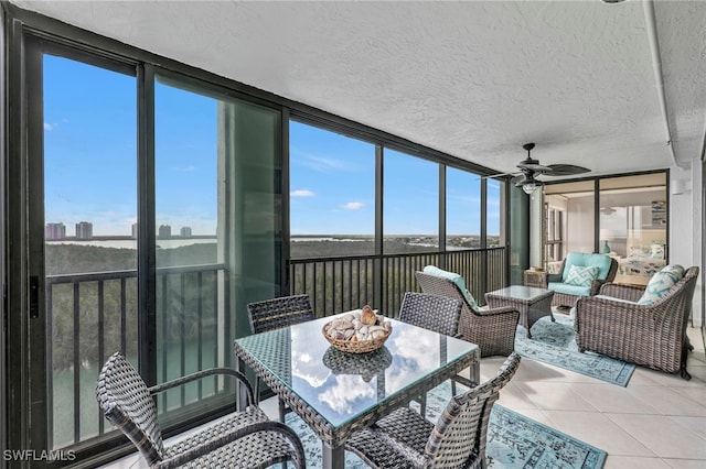 26235 Hickory Blvd Unit 9A, Bonita Springs, FL 34134 - sunroom / solarium featuring ceiling fan, floor to ceiling windows, tile patterned floors, a textured ceiling, and outdoor dining area