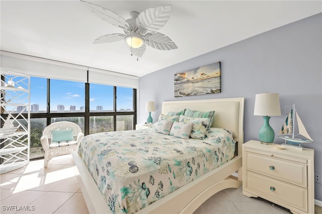 26235 Hickory Blvd Unit 9A, Bonita Springs, FL 34134 - bedroom with light tile patterned flooring, ceiling fan, and a city view