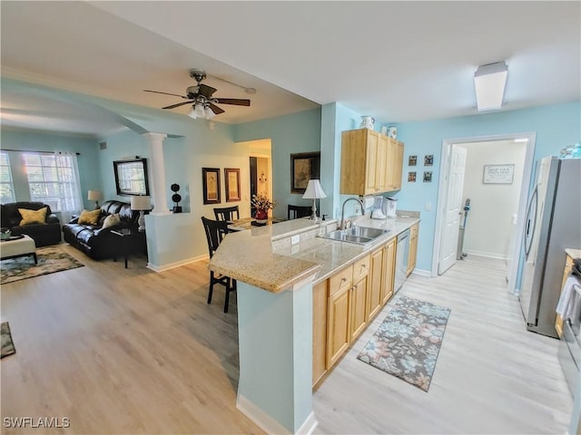 1776 Concordia Lake Cir Unit 2902, Cape Coral, FL 33909 - kitchen with a sink, light brown cabinetry, light wood finished floors, and stainless steel appliances
