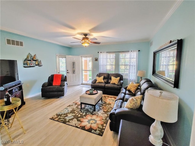 1776 Concordia Lake Cir Unit 2902, Cape Coral, FL 33909 - living area with ornamental molding, wood finished floors, plenty of natural light, ceiling fan, and baseboards