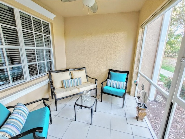 1776 Concordia Lake Cir Unit 2902, Cape Coral, FL 33909 - sunroom with a textured wall, a ceiling fan, and tile patterned flooring