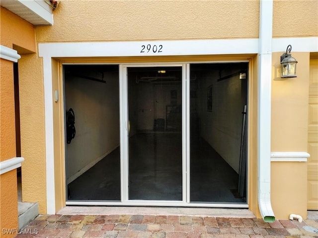 1776 Concordia Lake Cir Unit 2902, Cape Coral, FL 33909 - doorway to property with stucco siding