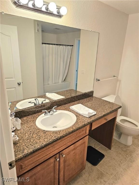 12975 Positano Cir Unit 104, Naples, FL 34105 - bathroom with vanity and tile patterned floors