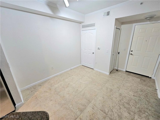 12975 Positano Cir Unit 104, Naples, FL 34105 - unfurnished bedroom with crown molding and two closets