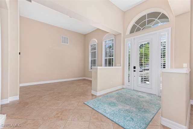 17091 Laurelin Ct, North Fort Myers, FL 33917 - foyer entrance featuring light tile patterned floors and baseboards