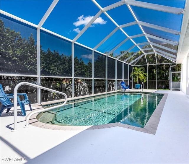 17091 Laurelin Ct, North Fort Myers, FL 33917 - swimming pool with a patio area and glass enclosure