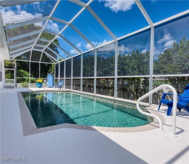 17091 Laurelin Ct, North Fort Myers, FL 33917 - swimming pool featuring a patio area, a storage unit, and a lanai