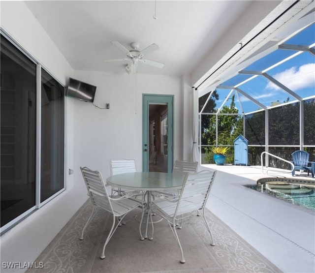 17091 Laurelin Ct, North Fort Myers, FL 33917 - view of patio featuring a ceiling fan, an in-ground hot tub, a lanai, and outdoor dining space
