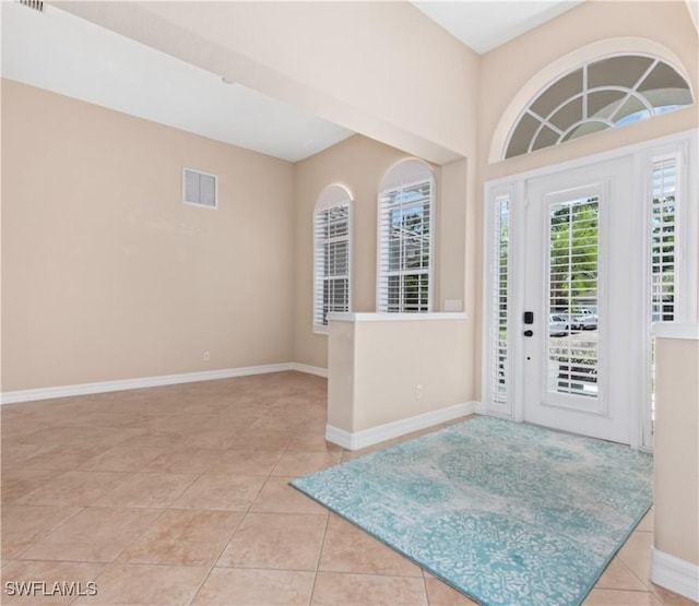 17091 Laurelin Ct, North Fort Myers, FL 33917 - entrance foyer featuring light tile patterned flooring and baseboards