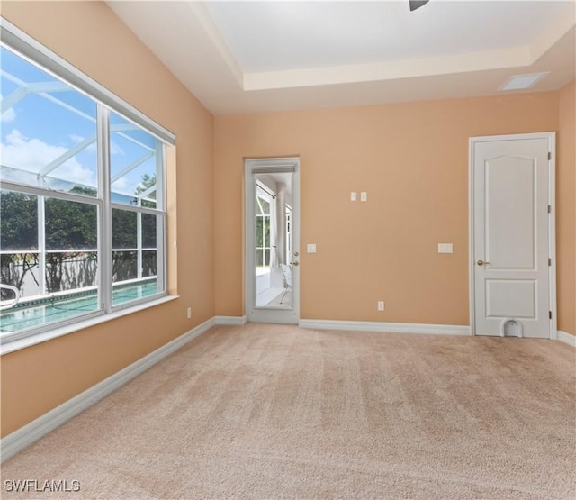 17091 Laurelin Ct, North Fort Myers, FL 33917 - empty room with light colored carpet and a tray ceiling