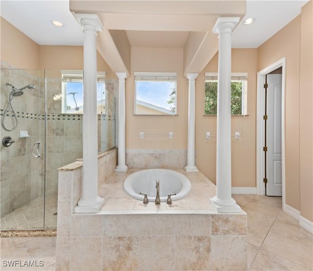 17091 Laurelin Ct, North Fort Myers, FL 33917 - bathroom featuring a bath, ornate columns, a stall shower, recessed lighting, and tile patterned floors