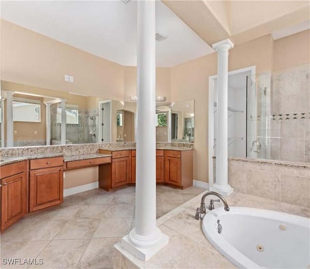 17091 Laurelin Ct, North Fort Myers, FL 33917 - full bath featuring a shower stall, decorative columns, a jetted tub, and vanity