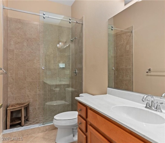 17091 Laurelin Ct, North Fort Myers, FL 33917 - full bathroom with vanity, a tile shower, and tile patterned flooring