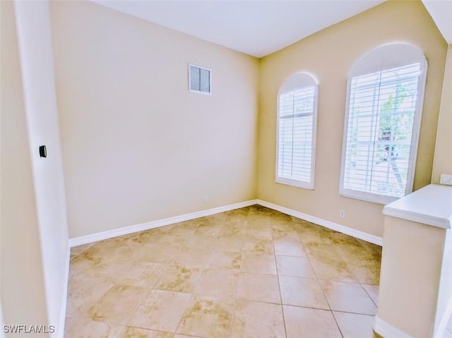 17091 Laurelin Ct, North Fort Myers, FL 33917 - empty room featuring light tile patterned floors and baseboards