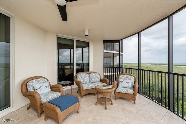1050 Borghese Ln Unit 605, Naples, FL 34114 - sunroom / solarium with healthy amount of natural light, a ceiling fan, and an outdoor hangout area