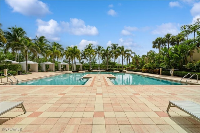 1050 Borghese Ln Unit 605, Naples, FL 34114 - community pool featuring a patio area