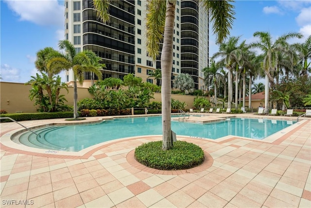 1050 Borghese Ln Unit 605, Naples, FL 34114 - community pool with a hot tub and a patio