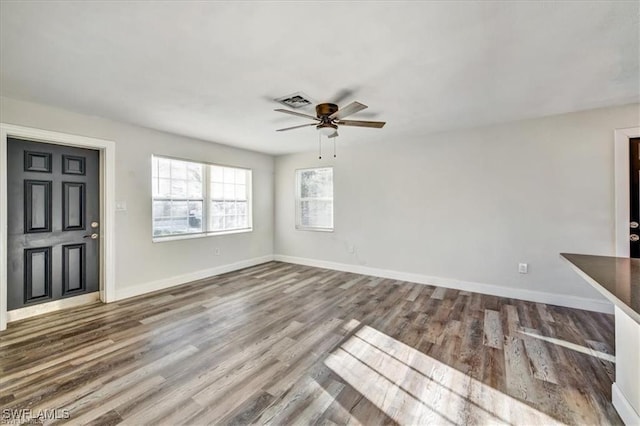 152 Prospect Ave, Fort Myers, FL 33905 - unfurnished living room featuring a ceiling fan and wood finished floors