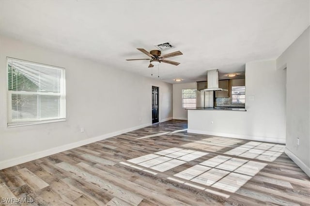 152 Prospect Ave, Fort Myers, FL 33905 - unfurnished living room with wood finished floors and ceiling fan