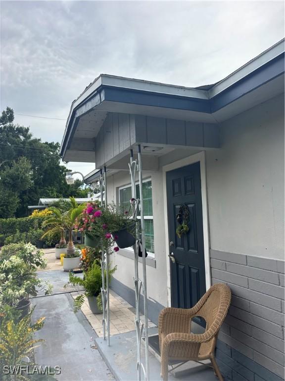 152 Prospect Ave, Fort Myers, FL 33905 - entrance to property with a patio area and stucco siding