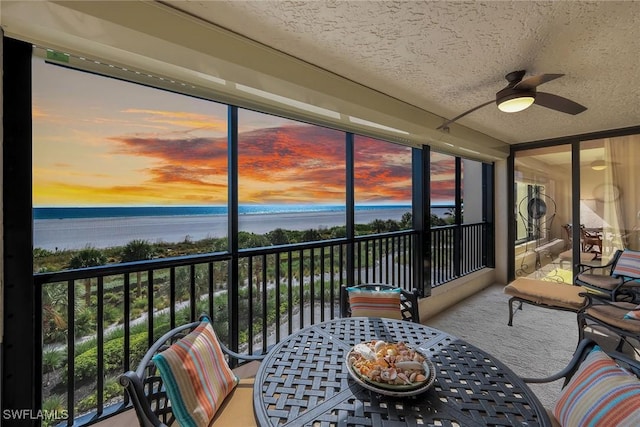 100 N Collier Blvd Unit 303, Marco Island, FL 34145 - sunroom featuring a water view, a ceiling fan, and outdoor dining area