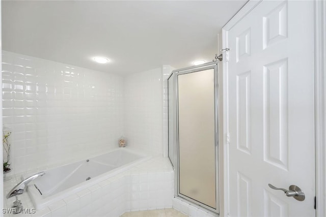 100 N Collier Blvd Unit 303, Marco Island, FL 34145 - full bath with a bath, a stall shower, and tile patterned flooring