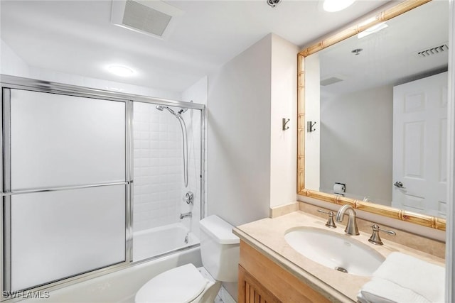 100 N Collier Blvd Unit 303, Marco Island, FL 34145 - full bath with toilet, vanity, and bath / shower combo with glass door