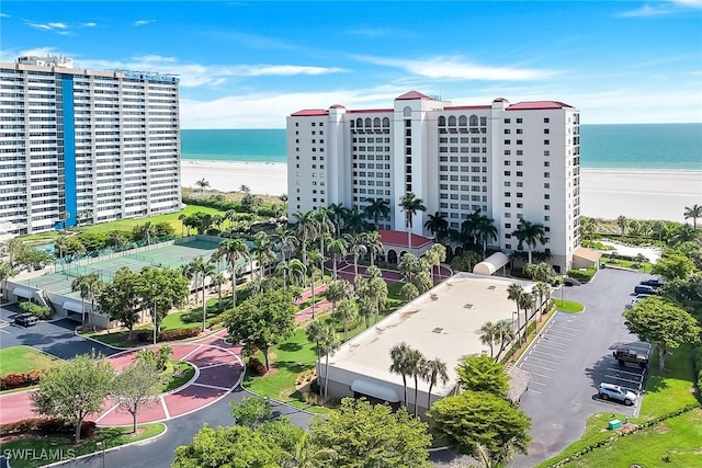 100 N Collier Blvd Unit 303, Marco Island, FL 34145 - bird's eye view of waterfront with a beach and apartment complex