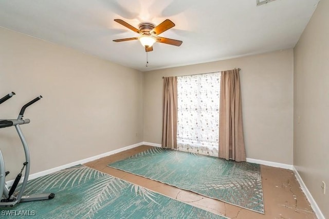 9749 Maplecrest Cir, Lehigh Acres, FL 33936 - workout room with ceiling fan and baseboards