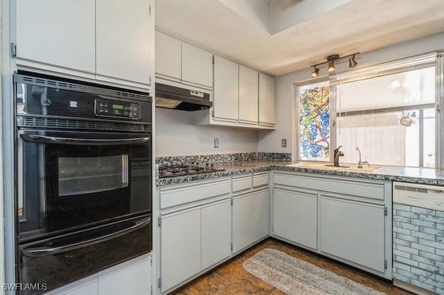 9749 Maplecrest Cir, Lehigh Acres, FL 33936 - kitchen with a warming drawer, oven, under cabinet range hood, dishwasher, and gas cooktop