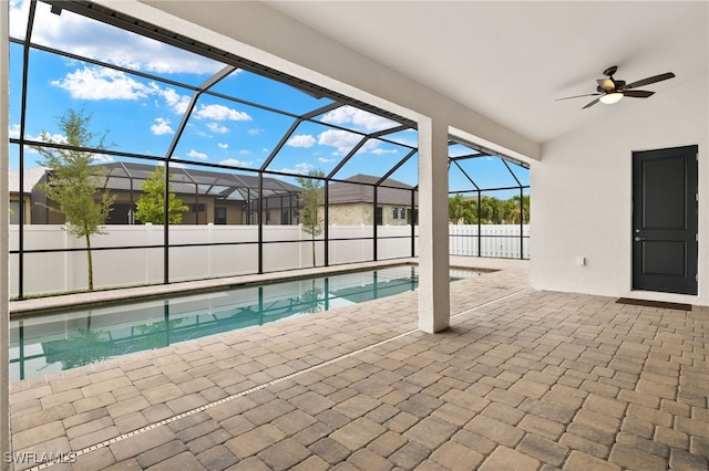 3318 NW 1st Ter, Cape Coral, FL 33993 - view of swimming pool featuring a patio, ceiling fan, and a lanai