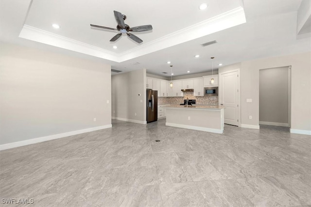16176 Rosemallow Ln, Alva, FL 33920 - unfurnished living room featuring a tray ceiling, ornamental molding, ceiling fan, and recessed lighting