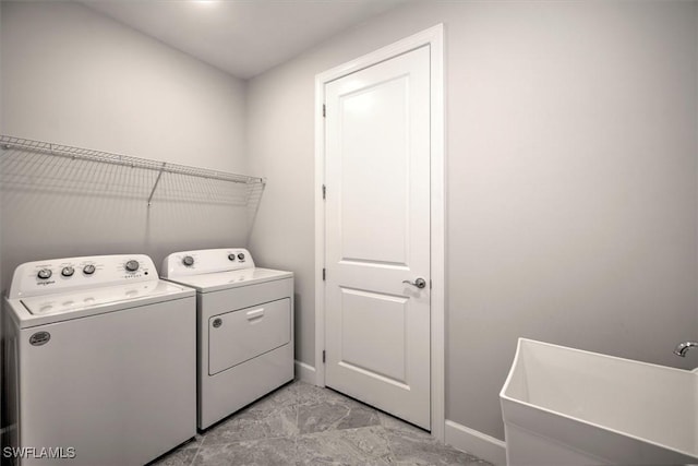 16176 Rosemallow Ln, Alva, FL 33920 - washroom featuring washing machine and dryer and baseboards