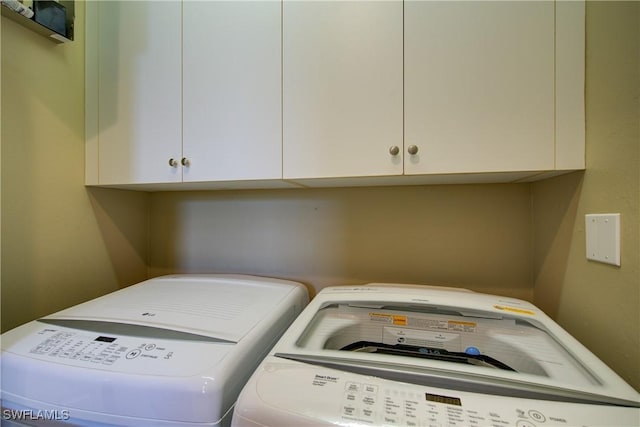 2855 Tiburon Blvd E Unit 102, Naples, FL 34109 - washroom featuring washing machine and dryer and cabinet space
