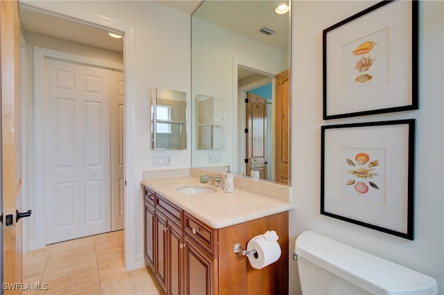 2855 Tiburon Blvd E Unit 102, Naples, FL 34109 - bathroom featuring vanity, tile patterned flooring, and recessed lighting