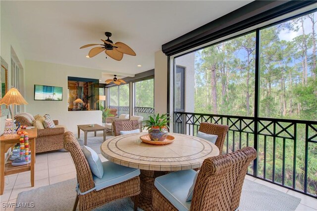 2855 Tiburon Blvd E Unit 102, Naples, FL 34109 - sunroom with a ceiling fan and outdoor dining area