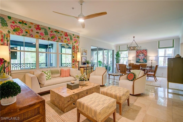 2855 Tiburon Blvd E Unit 102, Naples, FL 34109 - living room with ornamental molding, a chandelier, and ceiling fan