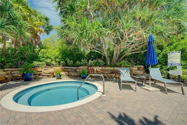 2855 Tiburon Blvd E Unit 102, Naples, FL 34109 - view of swimming pool featuring a patio
