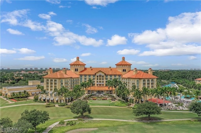 2855 Tiburon Blvd E Unit 102, Naples, FL 34109 - surrounding community with golf course view and a lawn