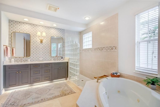 2855 Tiburon Blvd E Unit 102, Naples, FL 34109 - full bathroom with a whirlpool tub, double vanity, tile patterned flooring, and recessed lighting