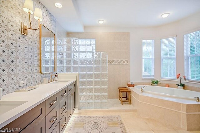 2855 Tiburon Blvd E Unit 102, Naples, FL 34109 - full bathroom featuring a garden tub, tile patterned floors, double vanity, a walk in shower, and recessed lighting