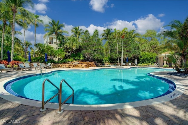 2855 Tiburon Blvd E Unit 102, Naples, FL 34109 - community pool with a patio area